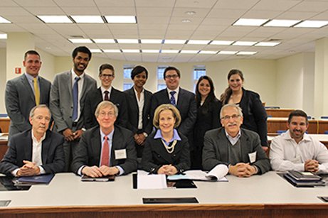 Law students and business students teamed up on Feb. 20 and 21, 2015, for the first UConn Law School-UConn Business School Joint Negotiation Competition. Marc Reich, second from right in the first row, was one of the competition judges.